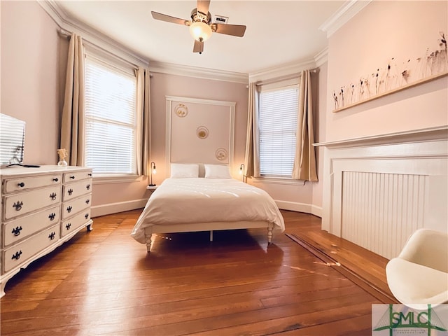 2203 Barnard St, Savannah, GA 31401 - bedroom with wood-type flooring, crown molding, baseboards, and a ceiling fan