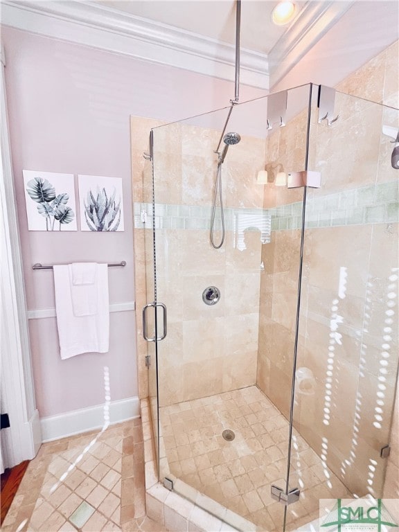 2203 Barnard St, Savannah, GA 31401 - bathroom with crown molding, a stall shower, baseboards, and tile patterned floors
