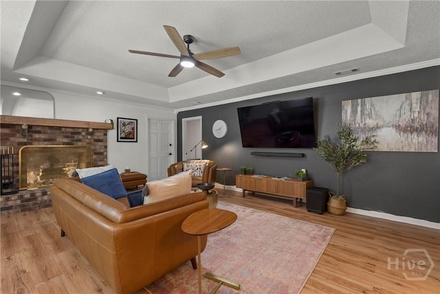 107 Rose Dhu Way, Savannah, GA 31419 - living room with a raised ceiling, a ceiling fan, wood finished floors, baseboards, and a textured ceiling