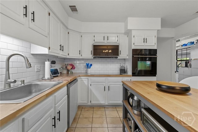 107 Rose Dhu Way, Savannah, GA 31419 - kitchen with oven, a sink, white cabinetry, backsplash, and light tile patterned floors