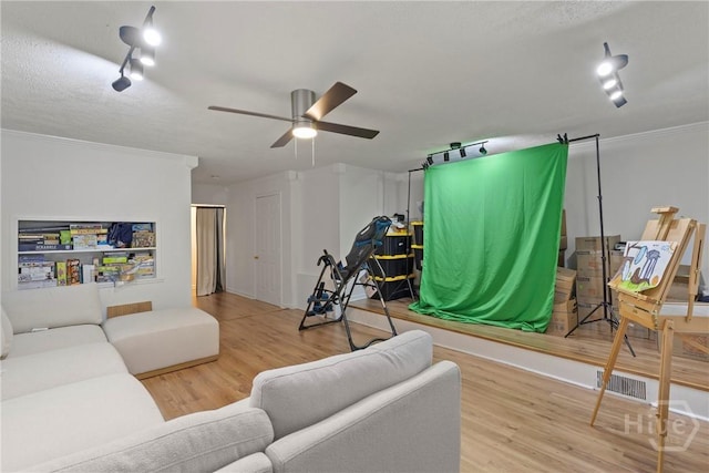 107 Rose Dhu Way, Savannah, GA 31419 - living room featuring rail lighting, wood finished floors, a ceiling fan, and crown molding
