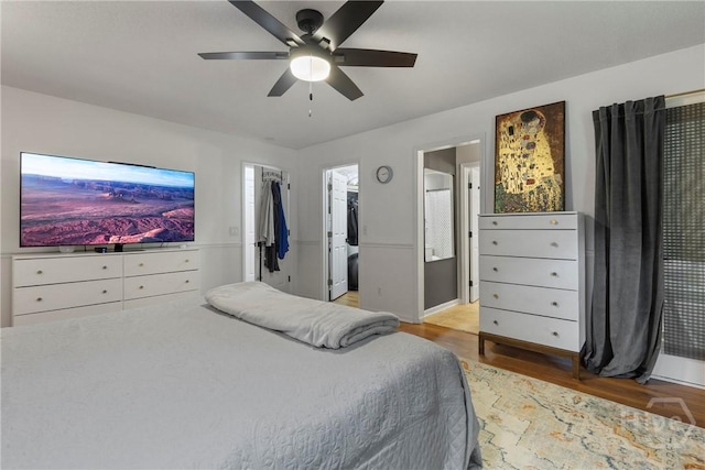 107 Rose Dhu Way, Savannah, GA 31419 - bedroom featuring a walk in closet, light wood finished floors, a ceiling fan, ensuite bathroom, and a closet