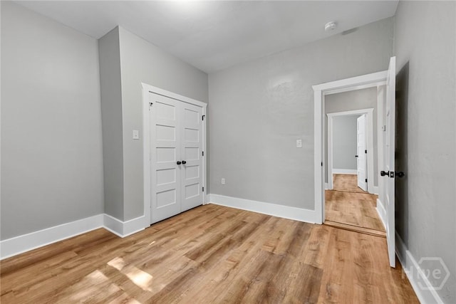 1825 Lloyd St, Savannah, GA 31405 - unfurnished bedroom featuring light wood-style flooring and baseboards