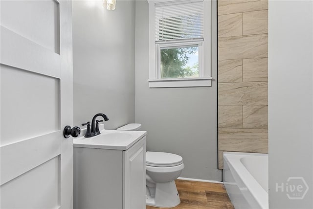1825 Lloyd St, Savannah, GA 31405 - bathroom with toilet, vanity, a tub to relax in, wood finished floors, and a shower