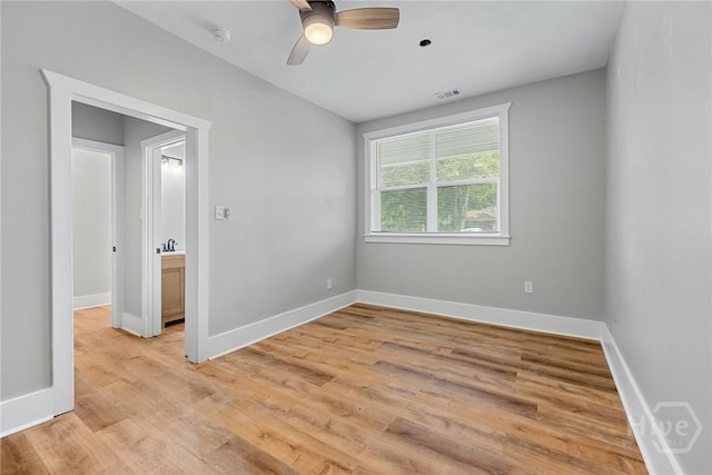 1825 Lloyd St, Savannah, GA 31405 - empty room with light wood-type flooring, ceiling fan, and baseboards