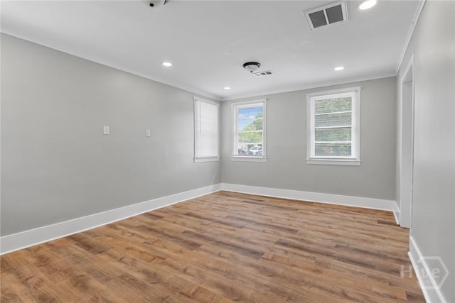 1825 Lloyd St, Savannah, GA 31405 - empty room featuring crown molding, baseboards, wood finished floors, and recessed lighting