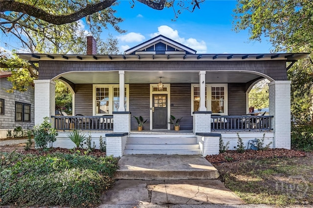 1001 Maupas Ave, Savannah, GA 31401 - view of front of house with a chimney and covered porch