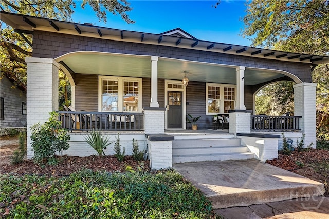 1001 Maupas Ave, Savannah, GA 31401 - view of front facade featuring a porch and brick siding