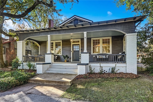1001 Maupas Ave, Savannah, GA 31401 - view of front of house with a porch, a chimney, and brick siding