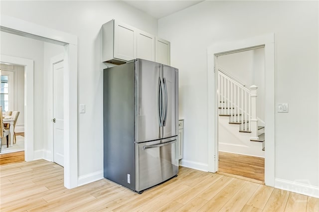 1001 Maupas Ave, Savannah, GA 31401 - kitchen with freestanding refrigerator, light wood finished floors, and baseboards