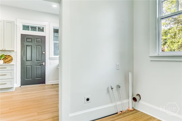 1001 Maupas Ave, Savannah, GA 31401 - laundry area featuring light wood-style flooring, healthy amount of natural light, baseboards, electric dryer hookup, and recessed lighting