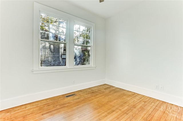 1001 Maupas Ave, Savannah, GA 31401 - spare room with wood finished floors and baseboards