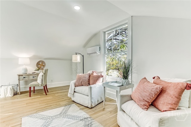 1001 Maupas Ave, Savannah, GA 31401 - sitting room with a wall unit AC, vaulted ceiling, wood finished floors, and baseboards