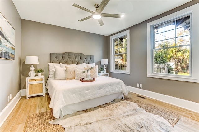 1001 Maupas Ave, Savannah, GA 31401 - bedroom with light wood finished floors, baseboards, and a ceiling fan