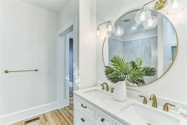 1001 Maupas Ave, Savannah, GA 31401 - full bathroom featuring double vanity, wood finished floors, and a chandelier