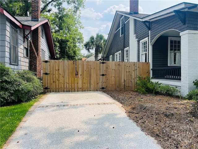 1001 Maupas Ave, Savannah, GA 31401 - view of side of home with a chimney and a gate