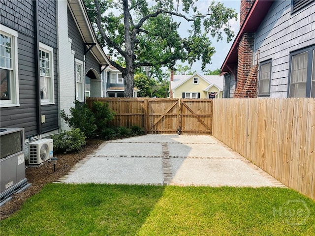 1001 Maupas Ave, Savannah, GA 31401 - view of yard with a cooling unit, a gate, and a patio area