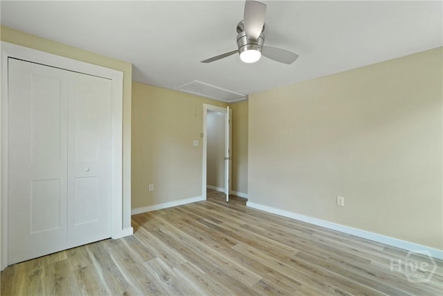 40 Circle Dr, Pembroke, GA 31321 - unfurnished bedroom featuring attic access, light wood-type flooring, a ceiling fan, and a closet