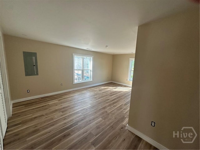 40 Circle Dr, Pembroke, GA 31321 - spare room featuring electric panel and wood finished floors
