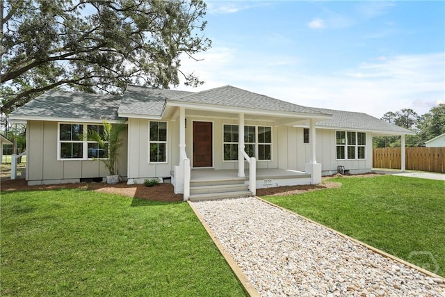 40 Circle Dr, Pembroke, GA 31321 - view of front of home with board and batten siding, roof with shingles, a porch, and driveway