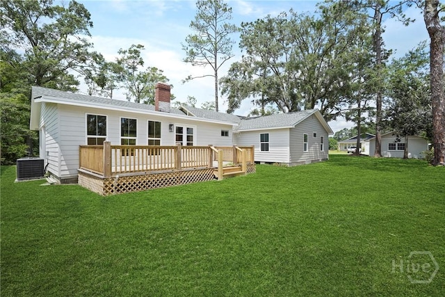 40 Circle Dr, Pembroke, GA 31321 - rear view of house with a lawn, a wooden deck, a chimney, and a shingled roof