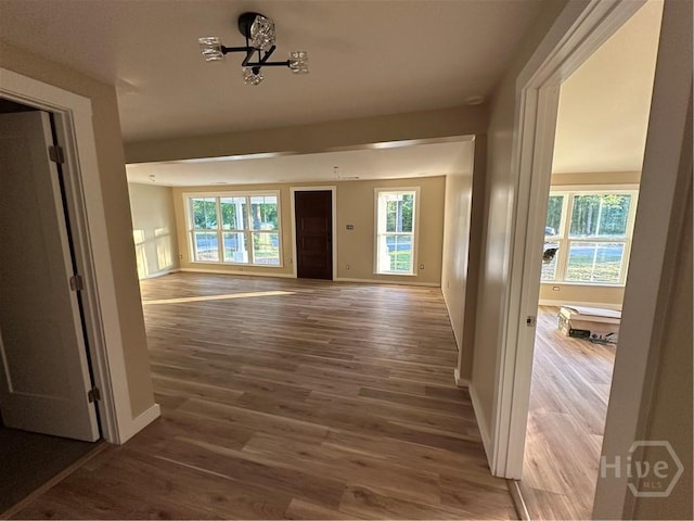 40 Circle Dr, Pembroke, GA 31321 - corridor featuring wood finished floors and a chandelier