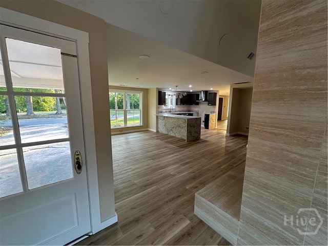 40 Circle Dr, Pembroke, GA 31321 - interior space with open floor plan, light countertops, wood finished floors, and a chandelier