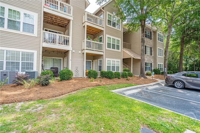 12300 Apache Ave Unit 1517, Savannah, GA 31419 - view of apartment building / complex featuring uncovered parking and central AC