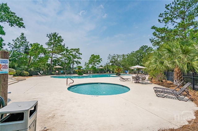 12300 Apache Ave Unit 1517, Savannah, GA 31419 - community pool featuring a patio