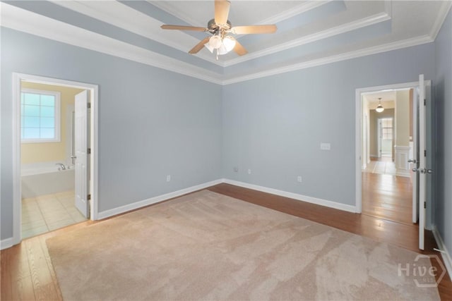201 Henderson Oaks Dr, Savannah, GA 31419 - unfurnished bedroom featuring crown molding, a raised ceiling, wood finished floors, connected bathroom, and baseboards