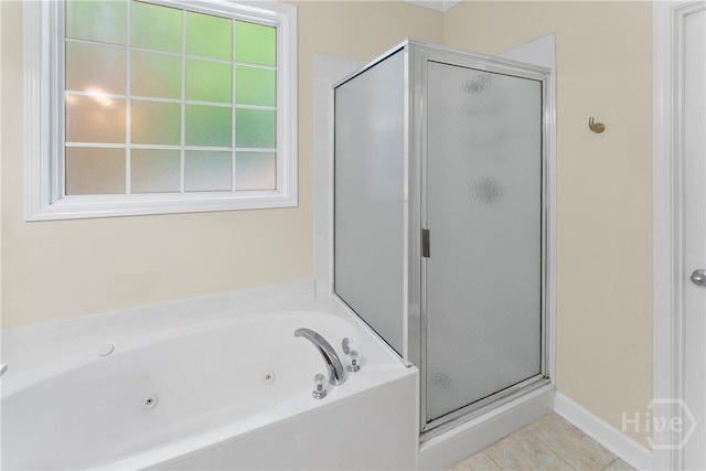 201 Henderson Oaks Dr, Savannah, GA 31419 - bathroom featuring a stall shower, a jetted tub, and tile patterned flooring