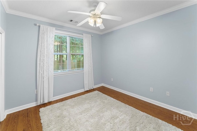 201 Henderson Oaks Dr, Savannah, GA 31419 - spare room with wood finished floors, crown molding, baseboards, and a ceiling fan