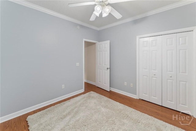 201 Henderson Oaks Dr, Savannah, GA 31419 - unfurnished bedroom with ornamental molding, wood finished floors, baseboards, ceiling fan, and a closet