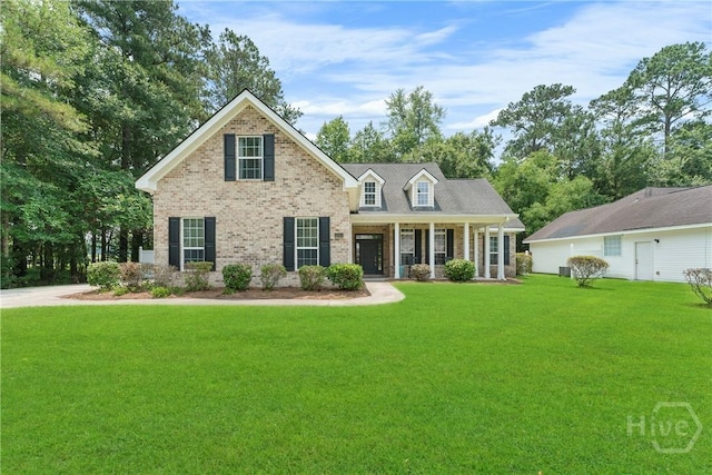 201 Henderson Oaks Dr, Savannah, GA 31419 - view of front of property with brick siding, a front lawn, and covered porch