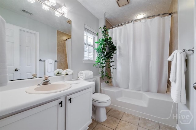 19 S Lake Dr, Savannah, GA 31410 - bathroom with vanity, shower / bath combo, tile patterned flooring, toilet, and a textured ceiling