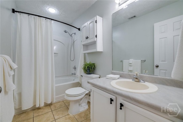 19 S Lake Dr, Savannah, GA 31410 - full bath featuring a textured ceiling, shower / tub combo with curtain, vanity, toilet, and tile patterned floors