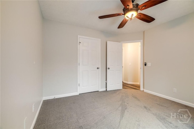 19 S Lake Dr, Savannah, GA 31410 - unfurnished bedroom featuring carpet flooring, baseboards, and a ceiling fan