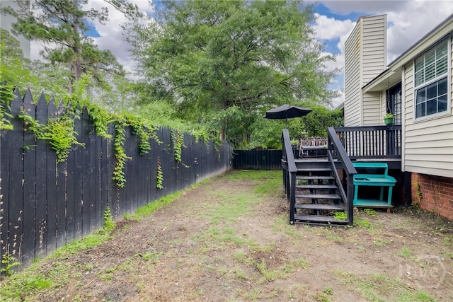 19 S Lake Dr, Savannah, GA 31410 - fenced backyard with a wooden deck