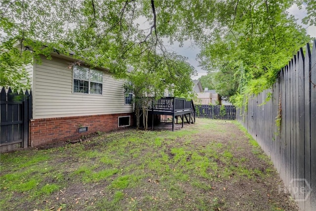 19 S Lake Dr, Savannah, GA 31410 - fenced backyard featuring a wooden deck