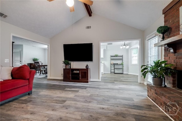19 S Lake Dr, Savannah, GA 31410 - living room with beamed ceiling, wood finished floors, ceiling fan, high vaulted ceiling, and baseboards