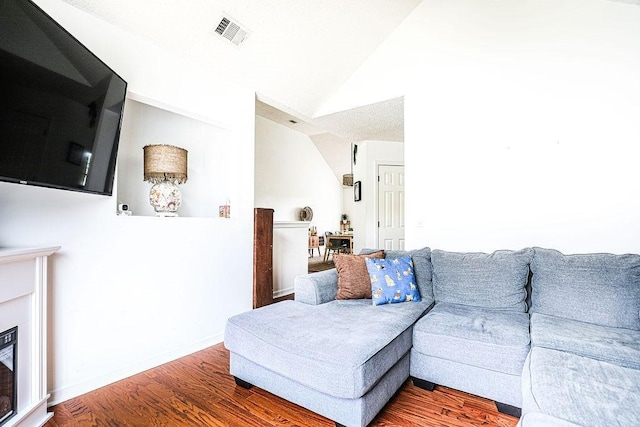 111 Runner Rd, Savannah, GA 31410 - living room featuring vaulted ceiling and wood finished floors