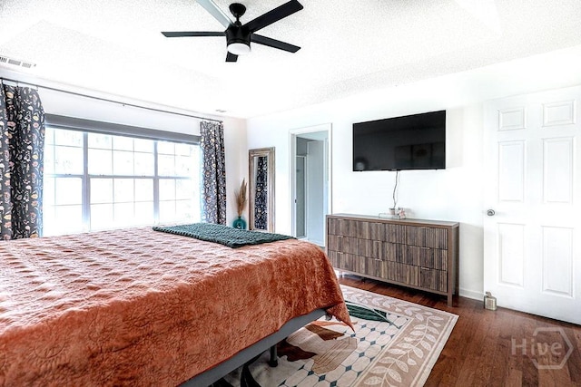 111 Runner Rd, Savannah, GA 31410 - bedroom with wood finished floors, a textured ceiling, a ceiling fan, and baseboards
