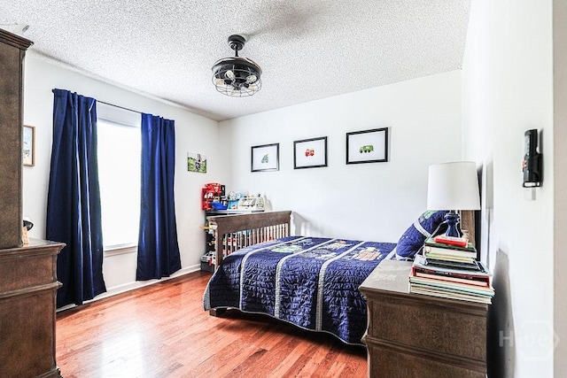 111 Runner Rd, Savannah, GA 31410 - bedroom featuring wood finished floors, a textured ceiling, and baseboards