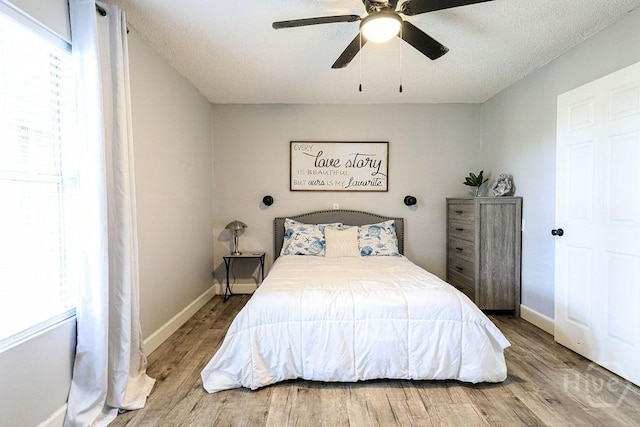 111 Runner Rd, Savannah, GA 31410 - bedroom featuring wood finished floors, multiple windows, and baseboards