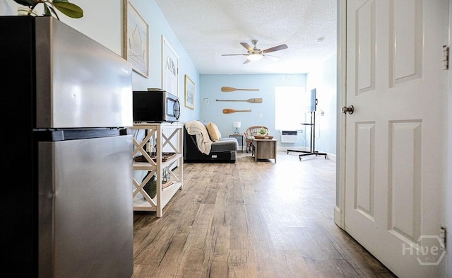 111 Runner Rd, Savannah, GA 31410 - living room with wood finished floors, ceiling fan, and a textured ceiling