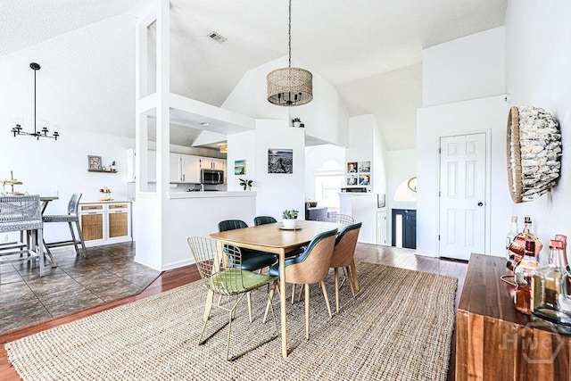 111 Runner Rd, Savannah, GA 31410 - dining space with wood finished floors and high vaulted ceiling