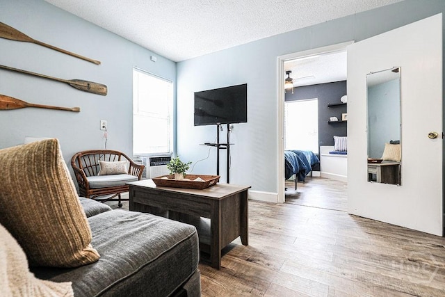 111 Runner Rd, Savannah, GA 31410 - living room with healthy amount of natural light, wood finished floors, a textured ceiling, and a ceiling fan