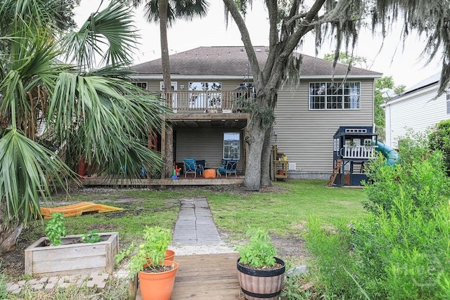 111 Runner Rd, Savannah, GA 31410 - rear view of property featuring a yard, a deck, and a shingled roof