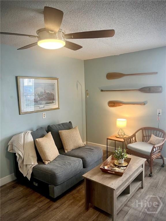 111 Runner Rd, Savannah, GA 31410 - living area with a textured ceiling, a ceiling fan, wood finished floors, and baseboards