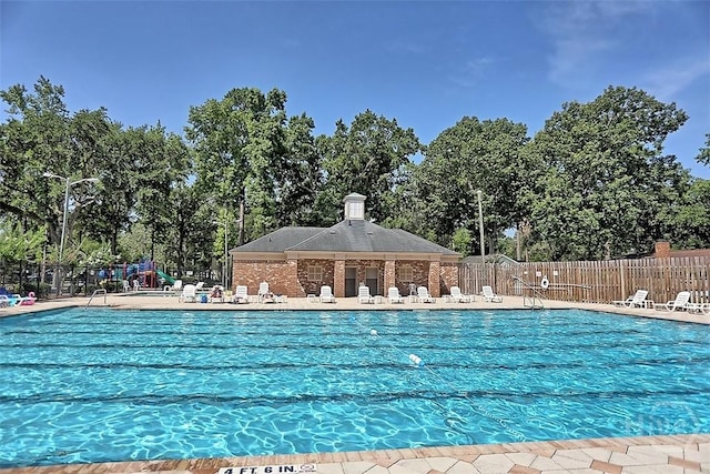 152 Saint Ives Dr, Savannah, GA 31419 - community pool featuring view of scattered trees and a patio